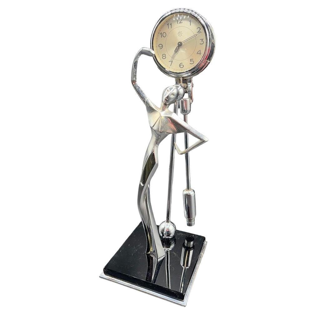 Art Deco "Mystérieuse" Chrome Female Figural Swinging Pendulum Clock by Junghans For Sale