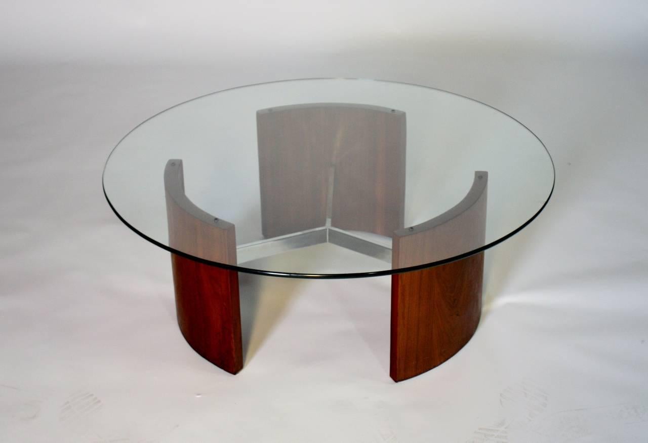 Vladimir Kagan attributed Radius cocktail table in walnut and chromed steel with a glass top. 

Cocktail table measures 40