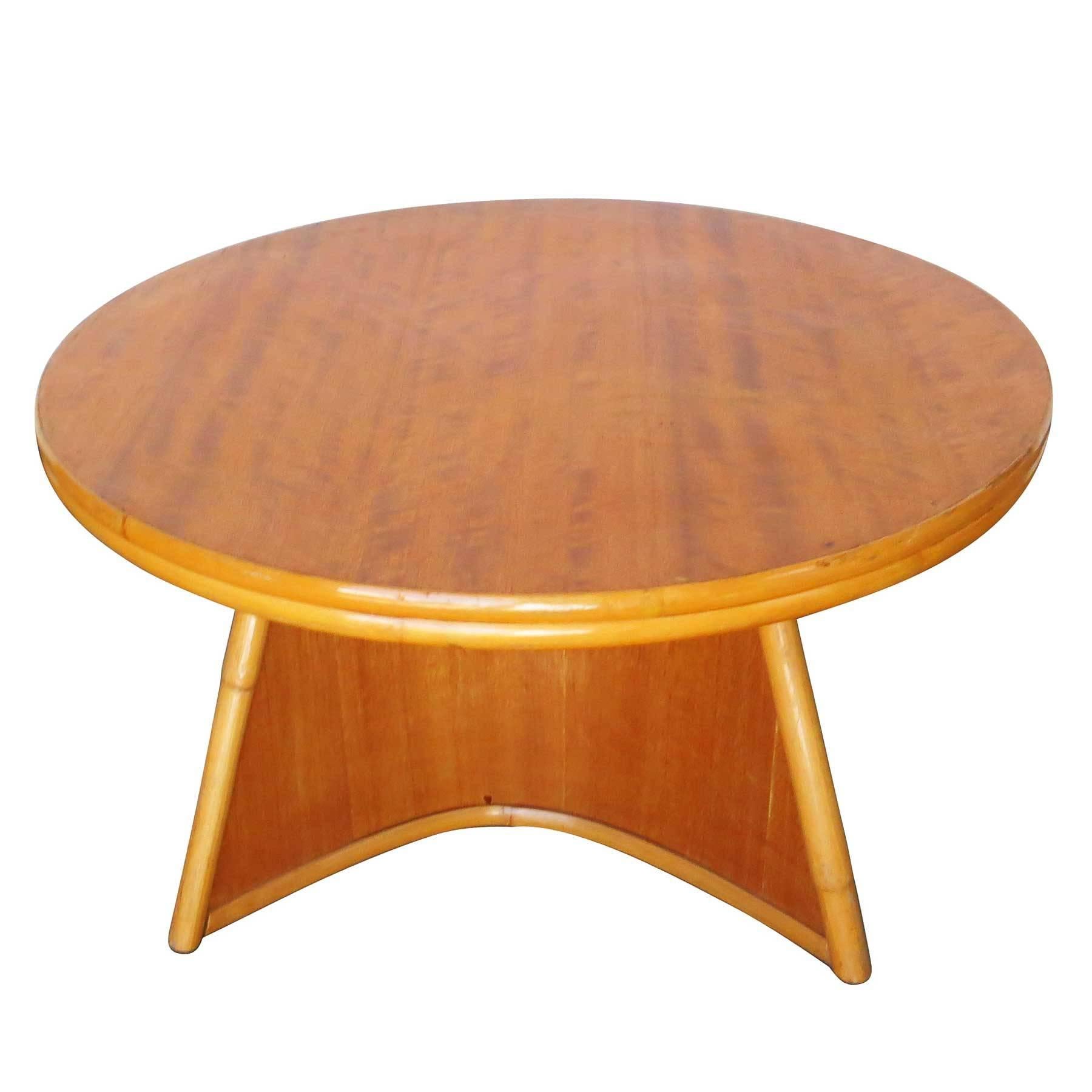 Set of three living room tables by Herbert and Shirley Ritts for the Rittz Furniture company. This set includes a round center table, a Biomorphic coffee table and a large two-tier table.

The bent mahogany with rattan borders complement the simple