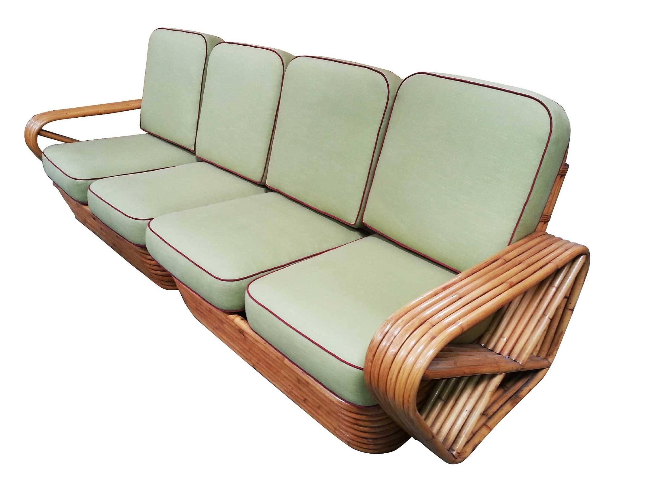 Square pretzel rattan sectional sofa designed by Paul Frankl. This sofa features a stacked rattan base with six strand square pretzel arms and is divided into a two pieces making a four personal sectional.

Please inquire about additional pieces