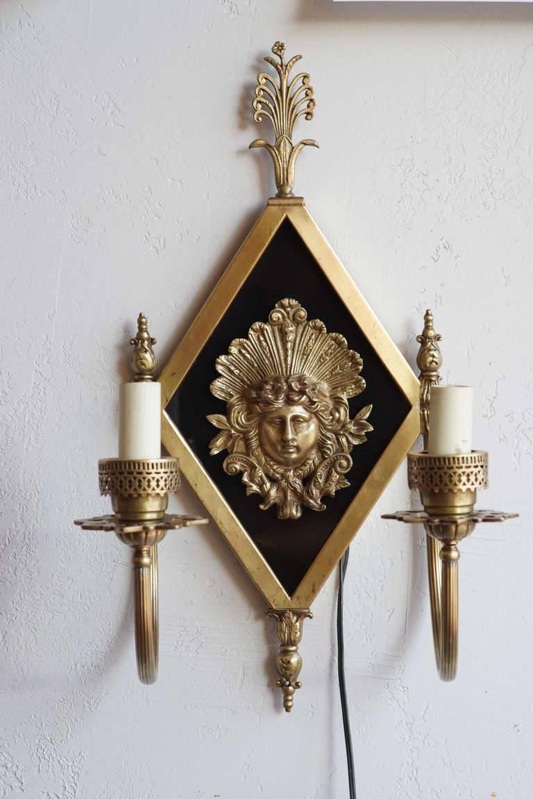 Stunning pair of early 20th century Neoclassical bronze two-arm sconces showcasing a Greek goddess centerpiece. 

From the Savoy-Plaza Hotel, 1927-1965, NYC.

Priced per piece.

Available: 3