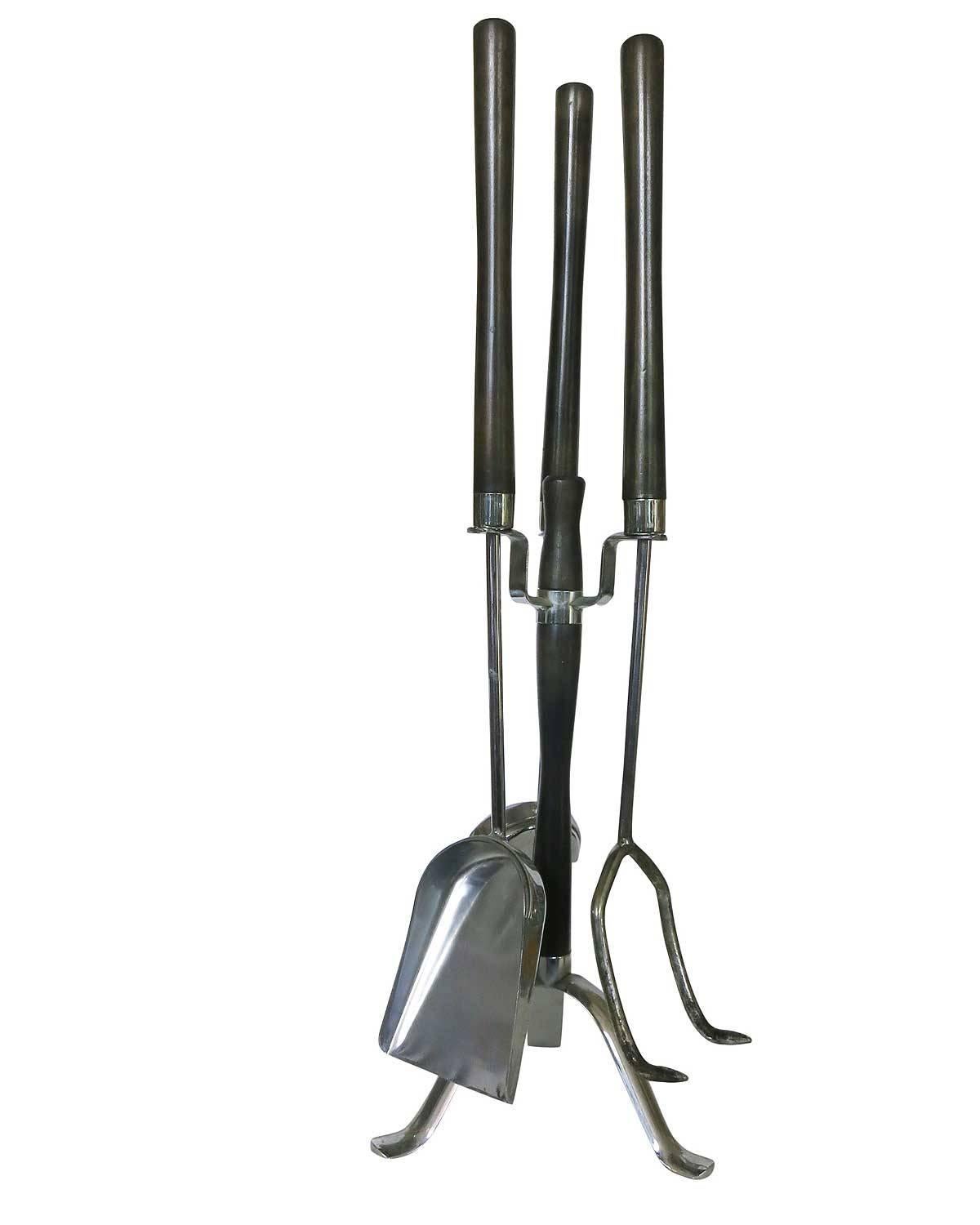 Set of four chrome and walnut fireplace tools by the Seymour Manufacturing Company. This unique set features a floating Jet age stand with poker, brush, and shovel.
Measures:
Broom: 29.5inches L x 4.5inches W x 4inches H.
Poker: 29.5inches L x