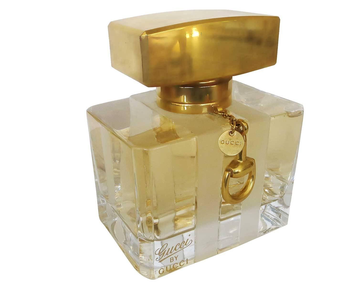 Gucci large-scale crystal factice display bottle. The elegant crystal fragrance bottle was a display from a department store fragrance counter.

The large-scale replica bottle is designed with brass stopper complete with charms bearing the Gucci