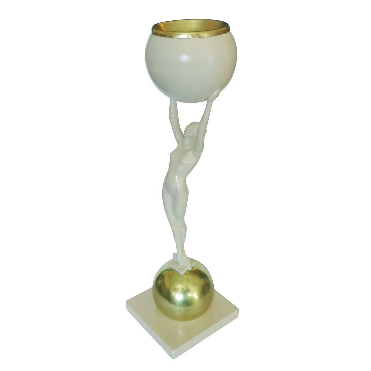 Frankart-style cocktail smoker pair featuring a nude female figure standing on top of a brass ball holding a beige ball with a removable brass ashtray along the top.

Dimensions: 28