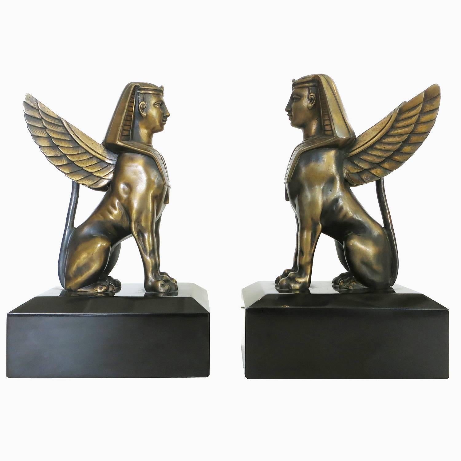 1920s inspired sculpture of sphinx solid bronze on absolute black marble. 

Could be used as bookends or figurine. Sold in pairs. 8.5