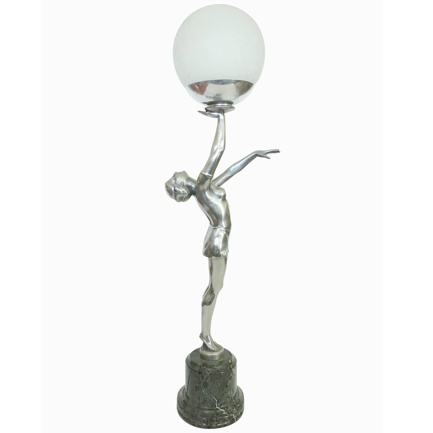 French Art Deco style nude danseuse lamp on a stepped marble base fashioned much after the French bronze sculpture Max Le Verrier. 

This gorgeous looking lamp features a casted bronze nude ballet dancer statue with an antique silver finish. This