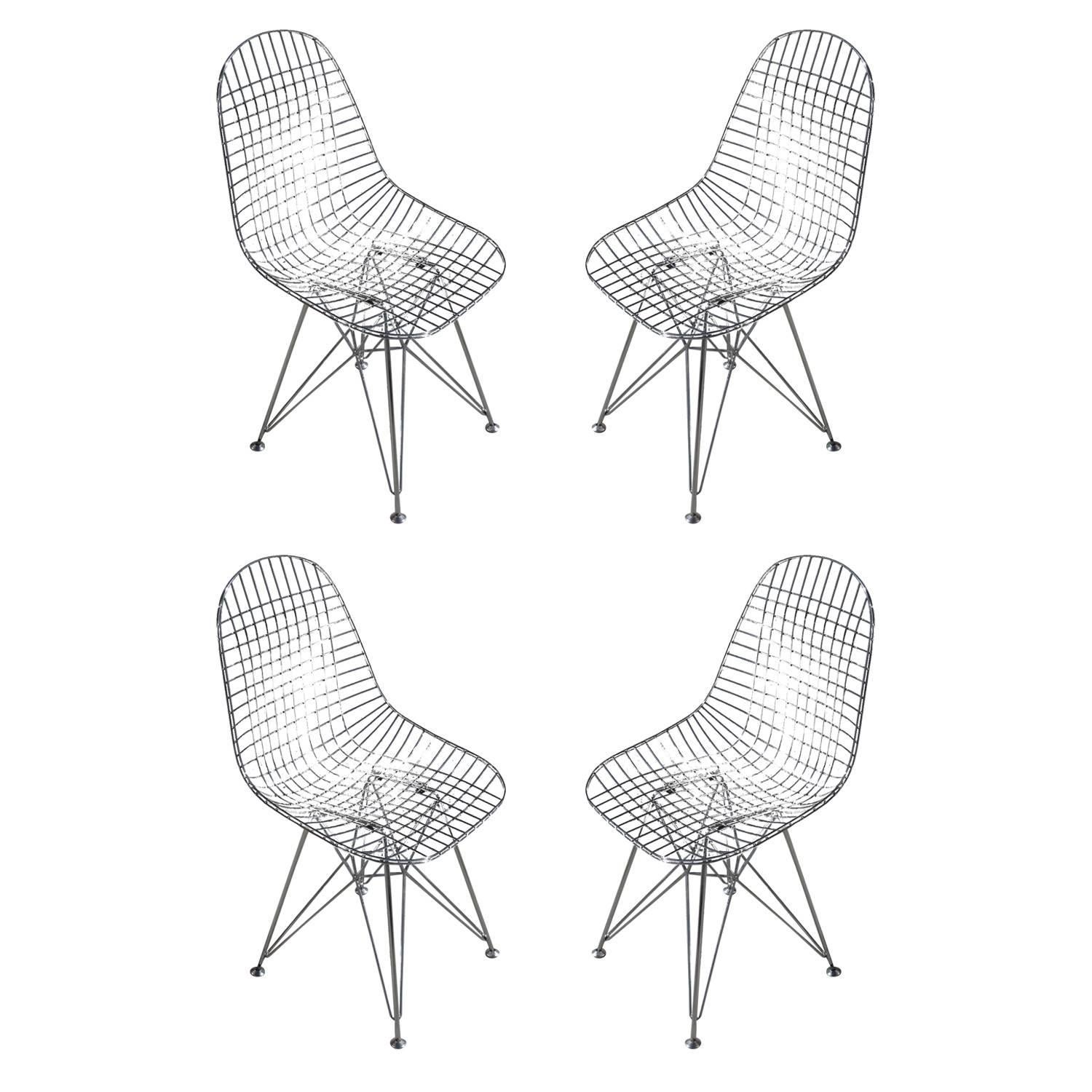 Set of six of chairs.

Charles and Ray Eames' experiments with welded wire led to the design of the DKR in 1951. DKR.0 stands for dining height, wire shell, rod base, no seat pad. The chairs' organic shape and airy silhouette are complemented by