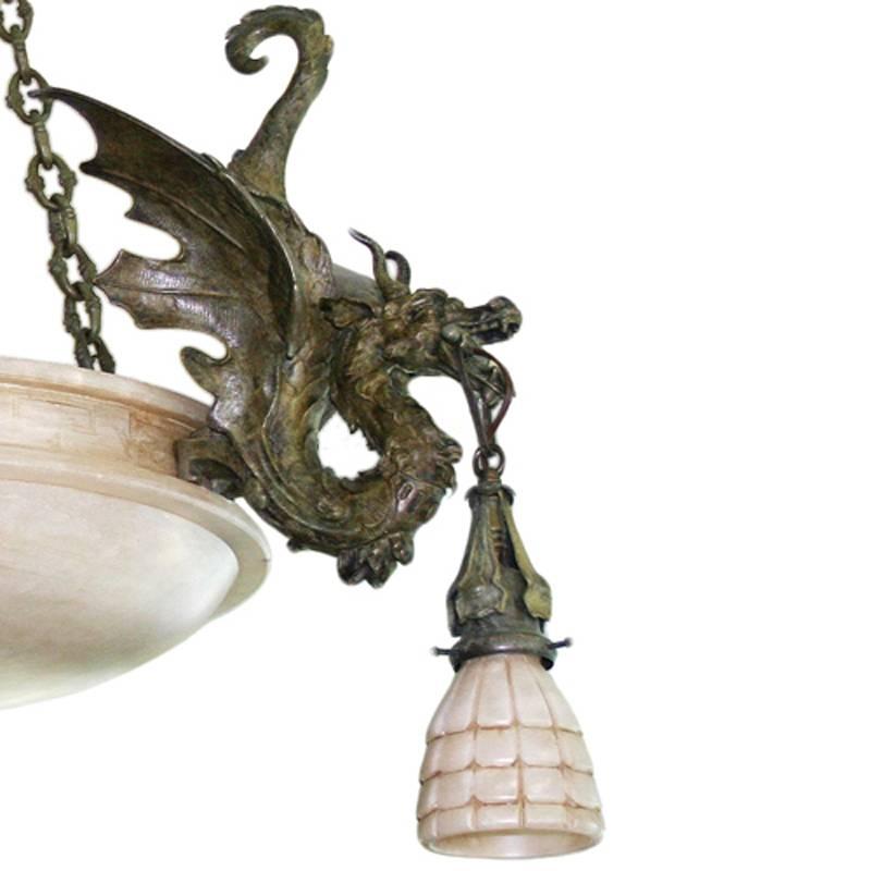Custom Gothic Revival style chandelier with bronze cast dragons and Spanish alabaster shades. Three “Lost Wax” cast dragons replicated from original late Victorian bronze dragons. 

The chandelier is suspended from a solid bronze ball with hook