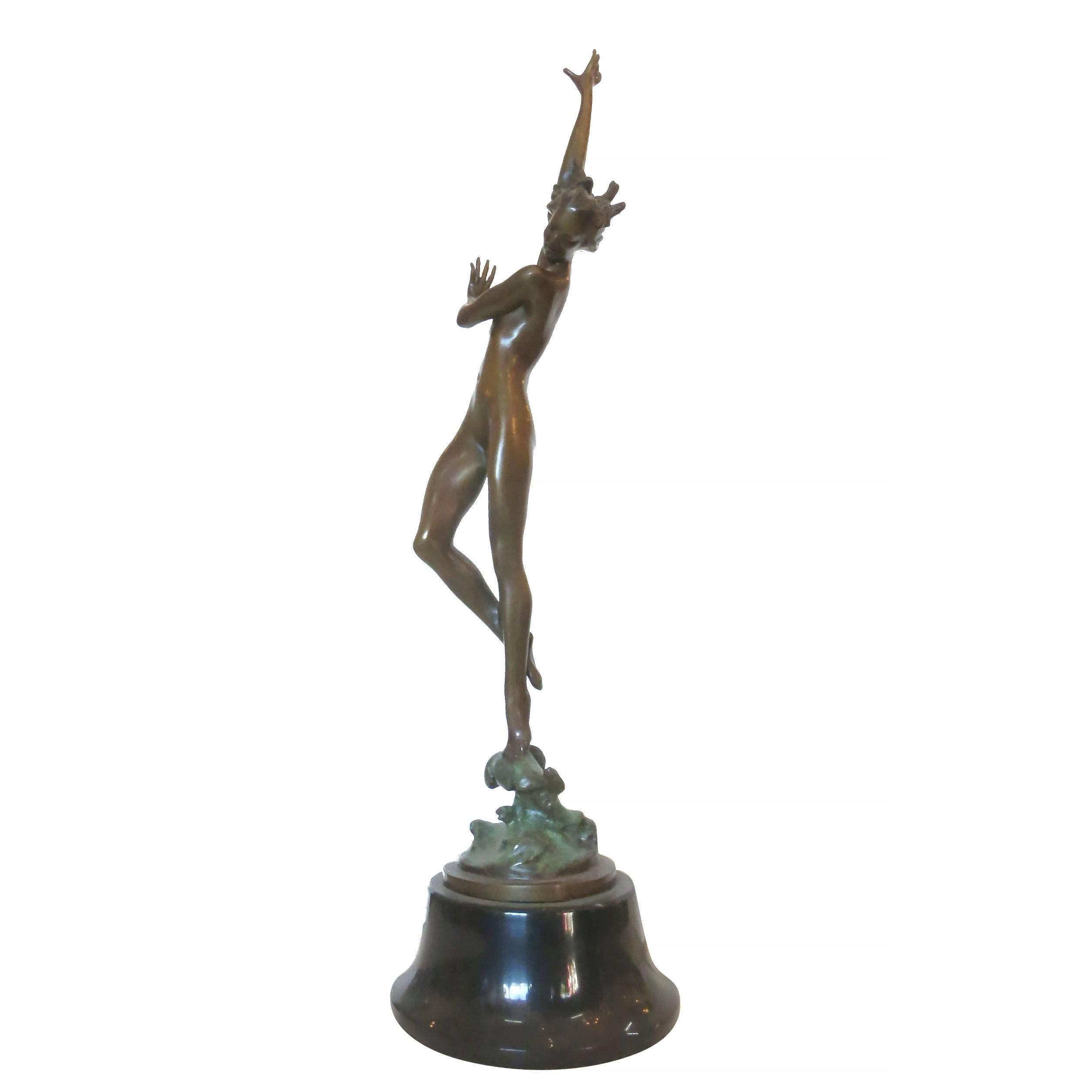 Art Deco style bronze figural nude dancer statue featuring a slender nude figural dancer fashioned after the works of Icart. The statue features an antique patina finish and stands on a marble base.

Product handcrafted in the USA with the highest