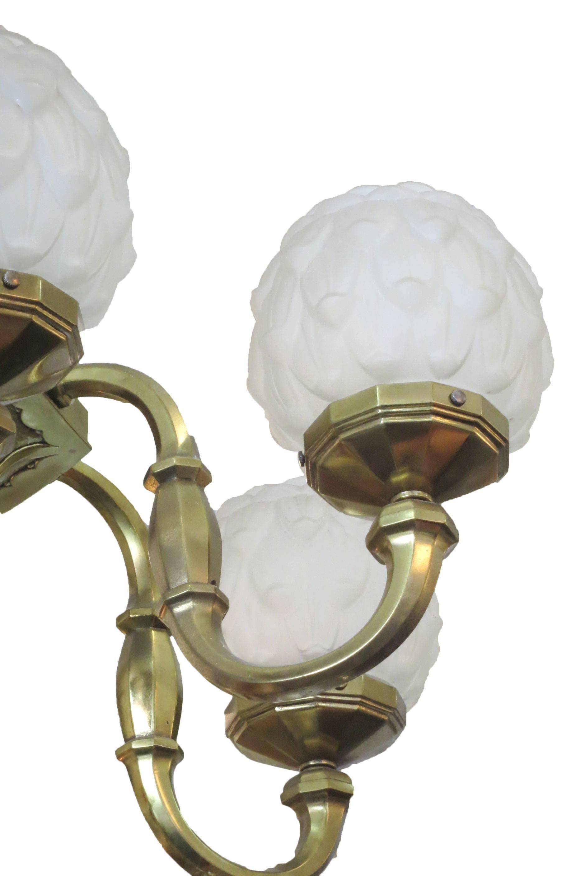 Dear Customer, I have marked many of my items for the 1stdibs Saturday Sale, take a look and save from 20% to 50% now. 

Early Art Deco chandelier with casted brass frame and arms in solid brass with original frosted glass globes in an artichoke