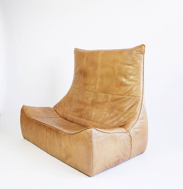 Dutch designer Gerard van den Berg created this sculptural sofa in 1970 for Montis, a company he founded with his brother. He was turning a corner from classic Mid-Century design to a more contemporary aesthetic. The sofa has an almost biomorphic
