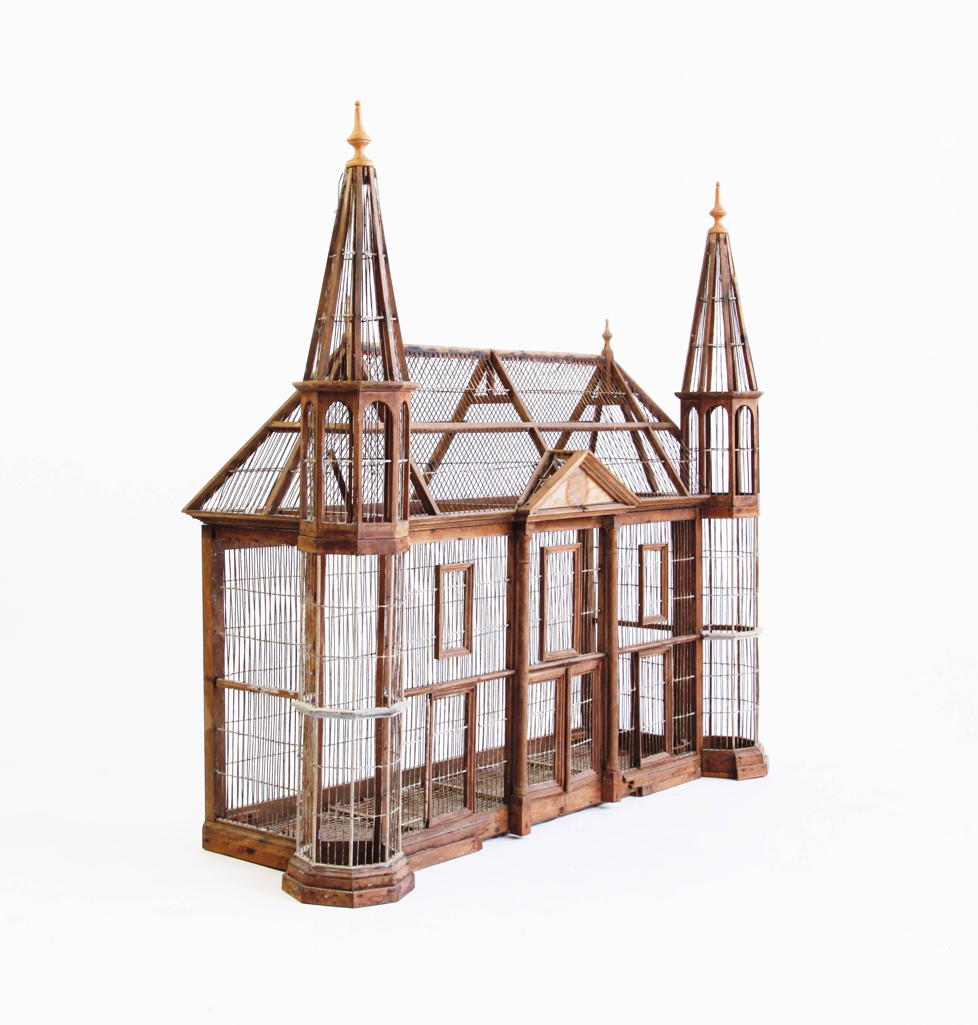 An extraordinary object. Constructed of wire, wood and a sheet metal tray, with the satisfying proportions of a Victorian manor house.