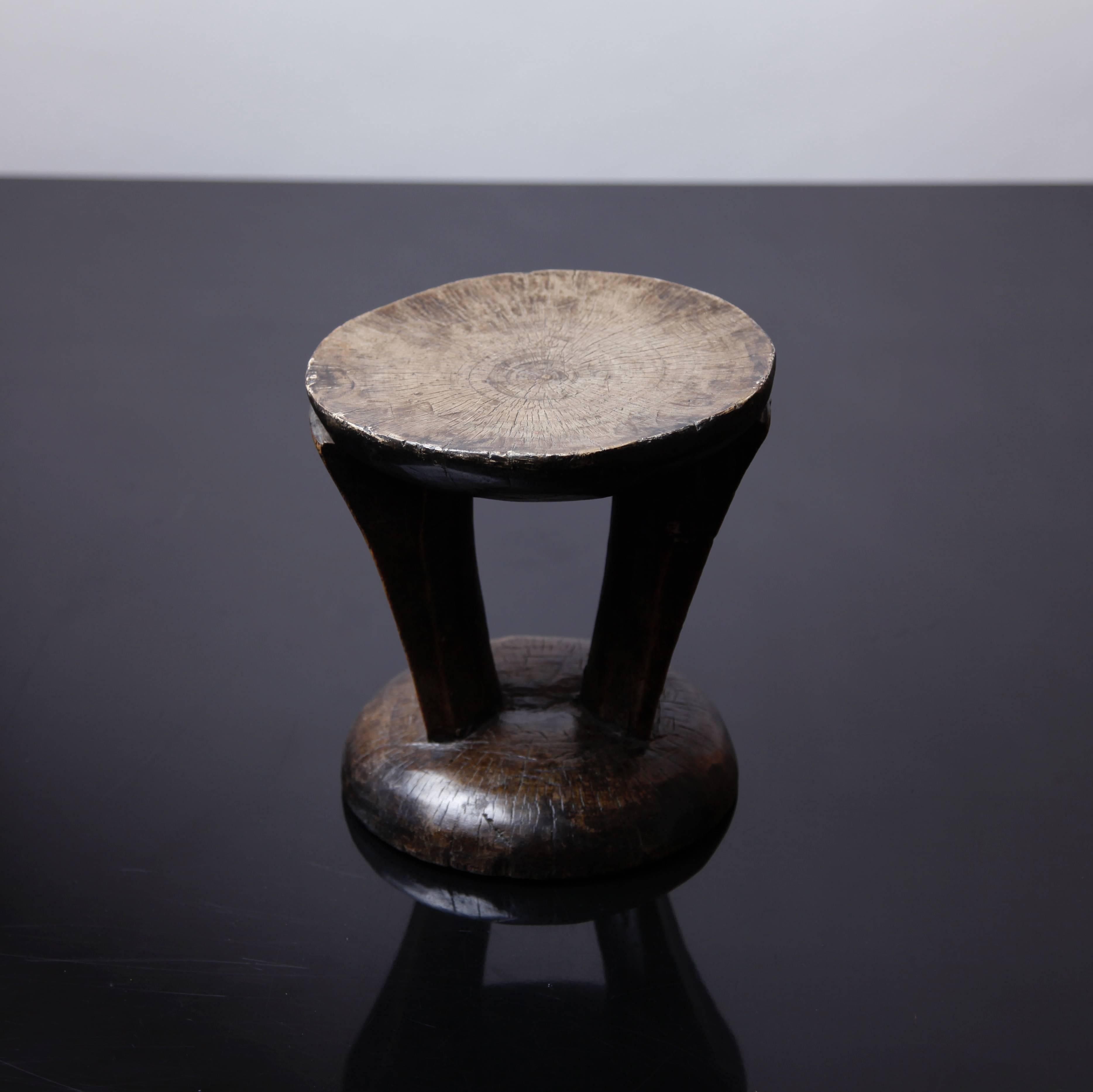 A beautifully sculpted Tonga stool, suitable as a small occasional table or a sculptural object.