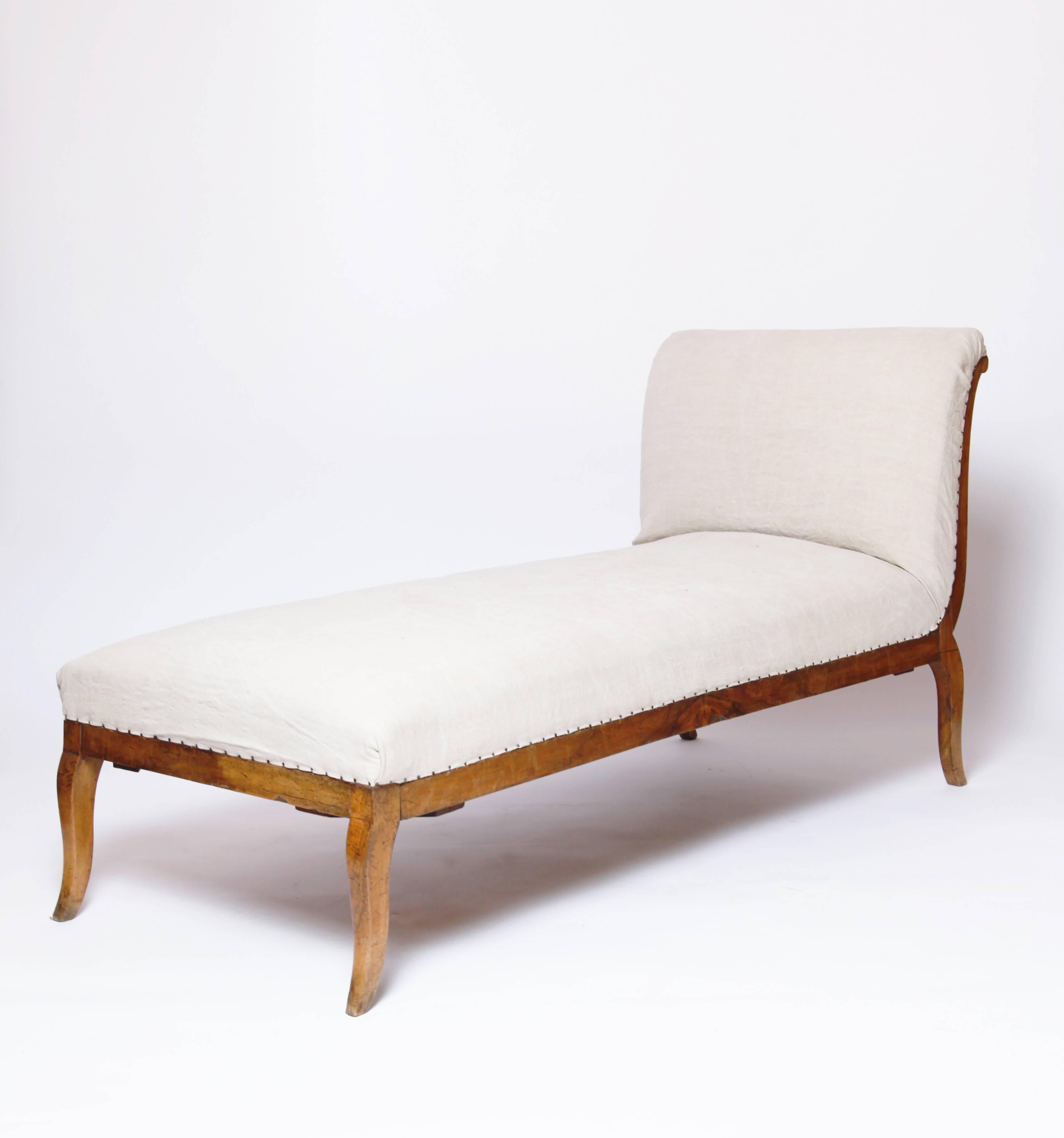 A simple and graceful lit de repos. The walnut frame has a beautiful surface quality, and the horsehair mattress has been covered in a rustic cotton canvas.