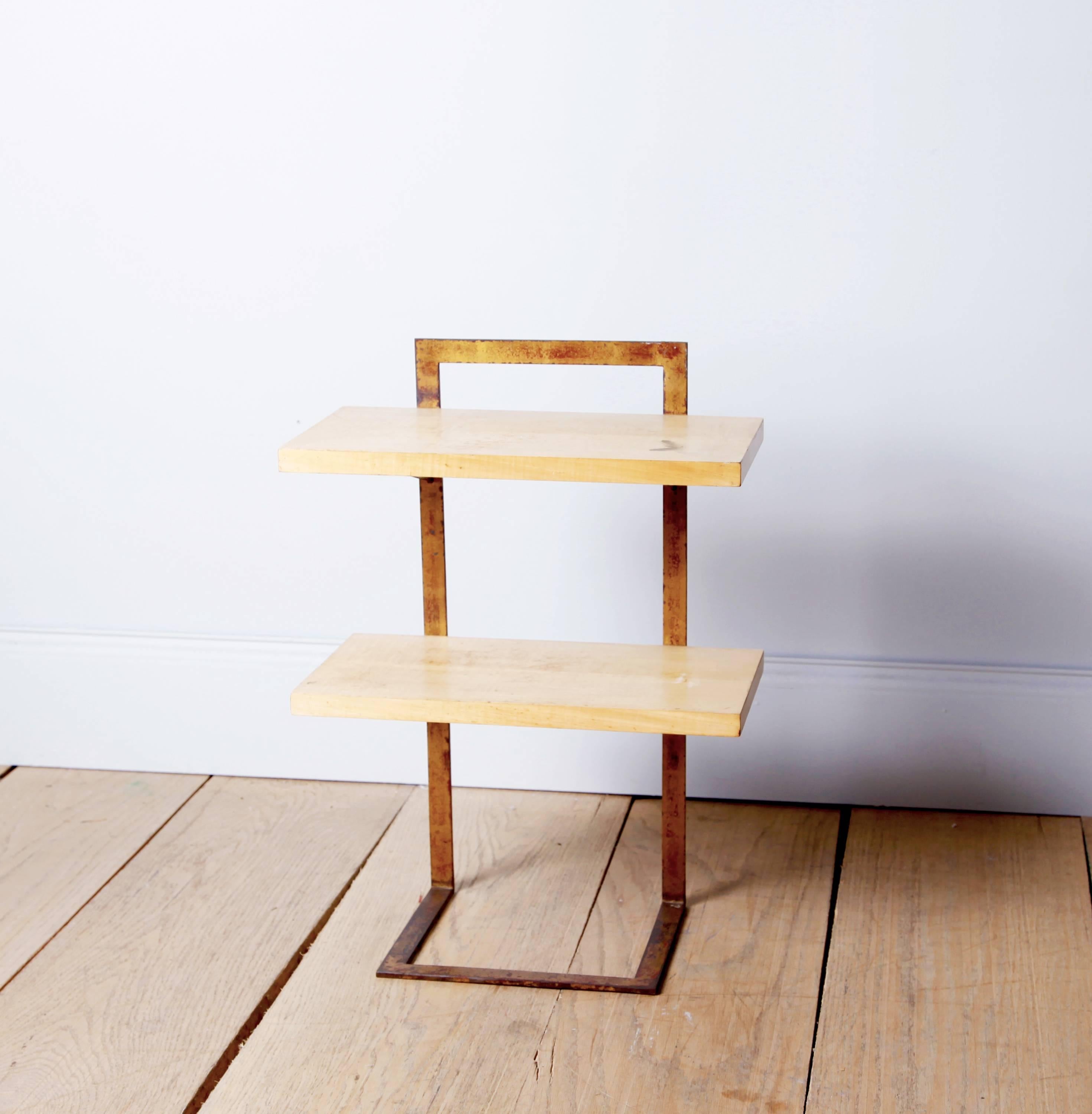 An exquisitely simple side table by the great self-taught French designer Jean Royère.