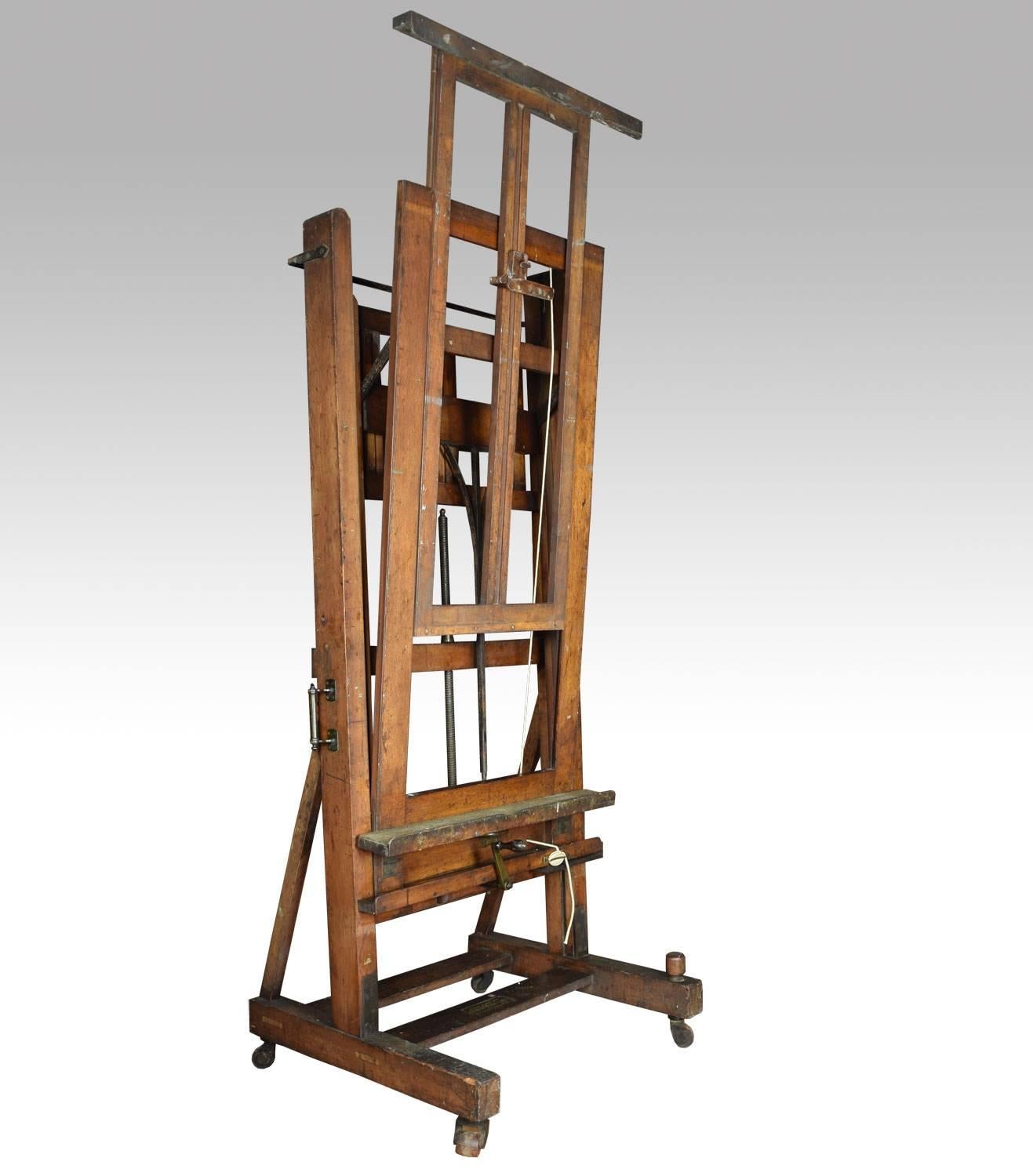 Large oak Windsor and Newton artist’s fully adjustable studio easel raised up on trestle base terminating in four lignum vitae casters.

Dimensions:

Height 161 when fully extended 86.5 inches when closed.

Width 37 inches.

Depth 32 inches.
