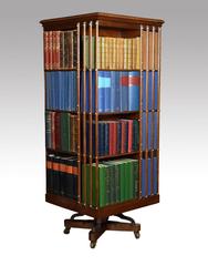 Large Edwardian walnut and ash four-tier revolving bookcase