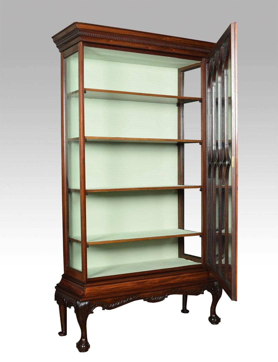 Large Chippendale revival single door string inlaid display cabinet, the dental moulded cornice above large single glazed door opening to reveal four adjustable shelves the display cabinet is raised up on claw and ball cabriole front legs with