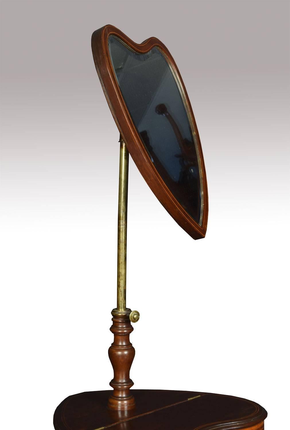 
Product description.

Sheraton revival mahogany shaving stand, the shield shaped bevelled mirror on brass adjustable pole, above shaped string inlaid section with lidded compartment all raised up on turned stem with three slender cabriole legs