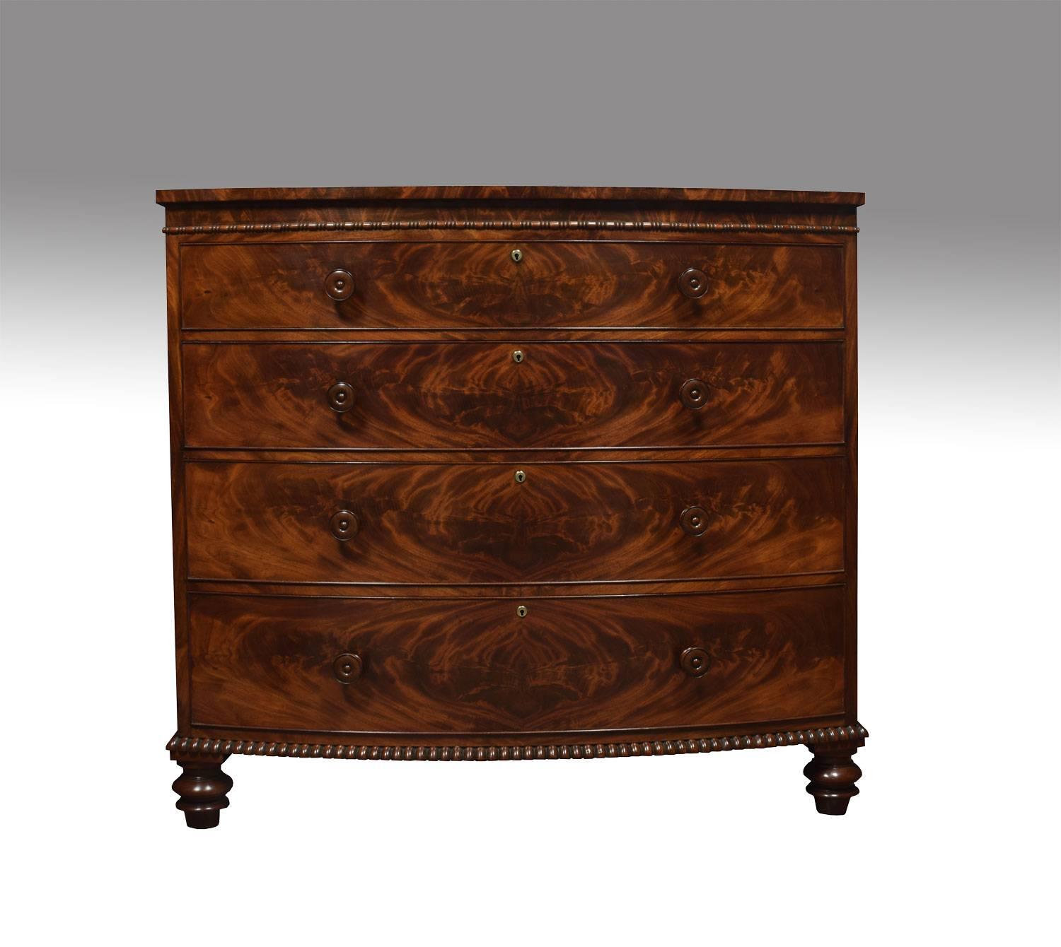 19th century mahogany chest of draws, the large bow fronted mahogany top above four well figured graduated draws, with turned handles and ash liners. Above gadroon moulding, all raised up on four turned feet. This chest of draws was probably made by