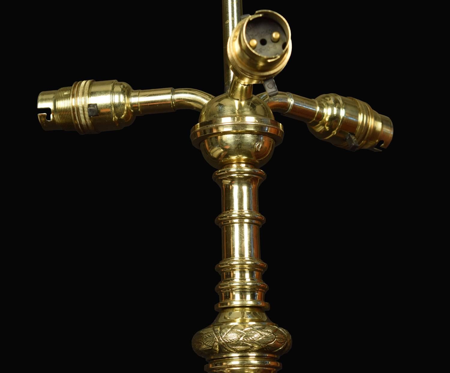 19th century brass standard lamp, the original shade above with reeded column and adjustable top column, on shaped splayed base with ram's heads and hoof feet (has been re-wired probably Irish)
Dimensions:
Height 65.5 inches adjustable to 84