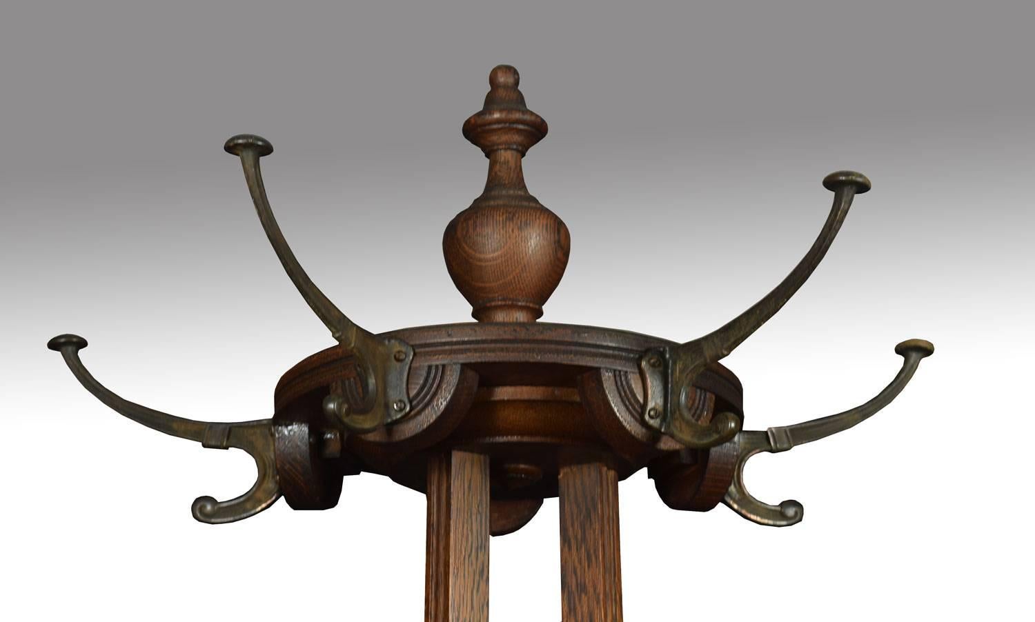Art Nouveau oak hall stand or umbrella stand, having brass hat and coat hangers and original drip tray to base.
Dimensions:
Height 83 inches
Width 25 inches
Depth 25 inches.