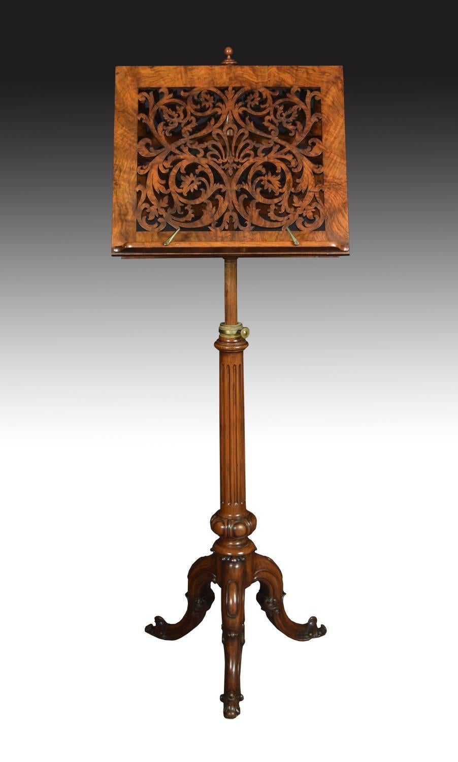 19th century burr walnut music duet stand the upper section comprising of two rectangular adjustable sheet music supports with carved and scrolling pierced detail , raised upon a turned central column with three carved scrolled