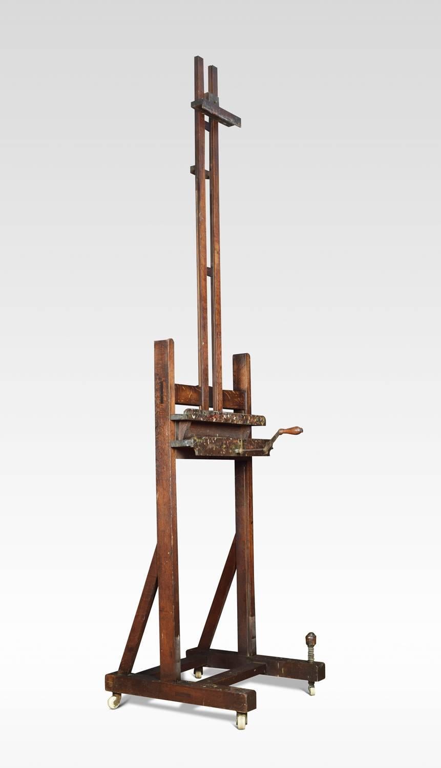 Large oak artist’s adjustable studio easel raised up on trestle base terminating in four ceramic casters

Dimensions
Height 112 when fully extended 74 inches when closed
Width 25.5 inches
Depth 27 inches.