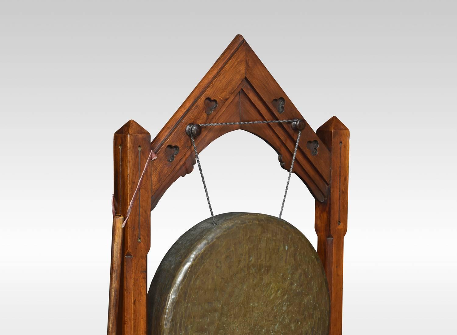 Victorian Gothic Revival oak framed dinner gong, the architectural top above carved supports having canted corner, with suspended brass gong to centre raised up on block feet.
Dimensions:
Height 46 inches
Width 21 inches
Dept 13.5