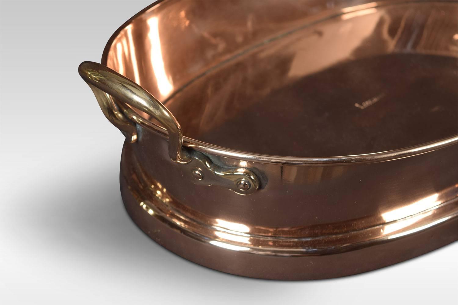 Large heavy copper oval baking dish, saute pan or paella dish with conforming brass handles.
Dimensions
Height 6.5 inches
Width 21 inches
Depth 12.5 inches.