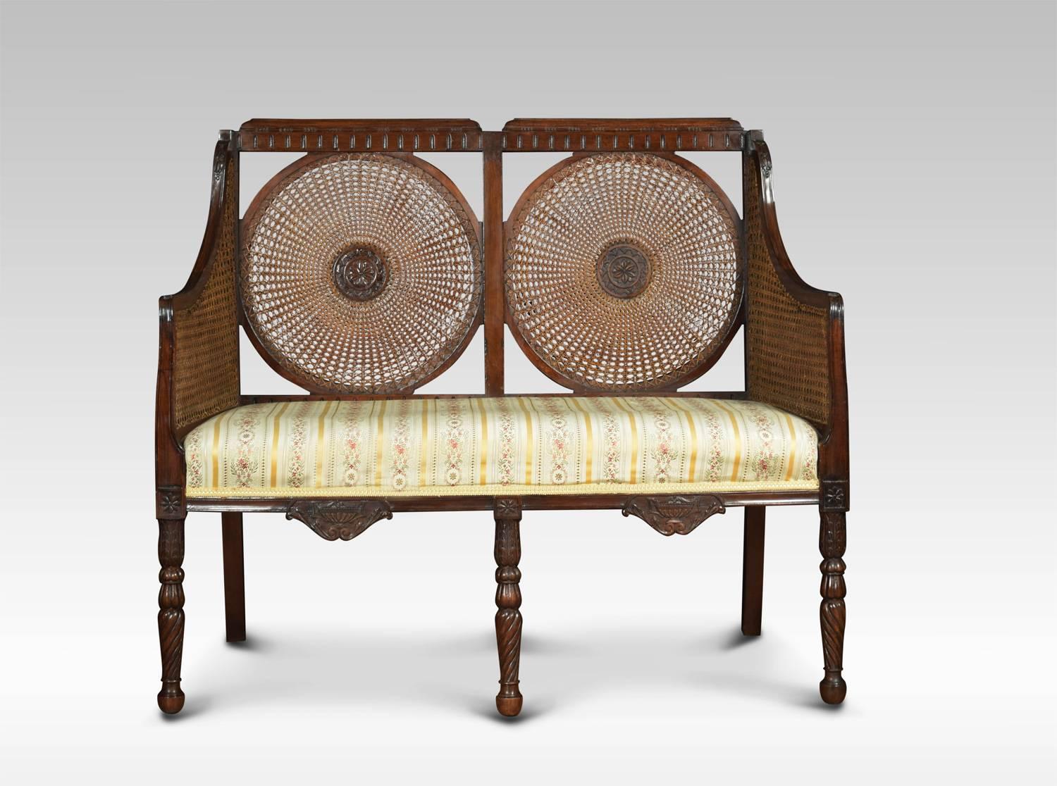 Two-seat bergere settee, the solid mahogany frame, with inset with double circular panelled cane work back and upholstered seat. Raised up on finely carved fluted front legs
Dimensions
Height 37 inches height to seat 18 inches
Width 43