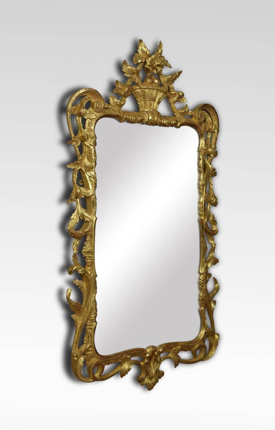 A pair of George III style gilt framed mirrors, with floral basket crest over pierced and carved frame and open scroll lower frieze surrounding original mirror plate.
Dimensions
Height 54 inches
Width 30 inches
Depth 4.5 inches.