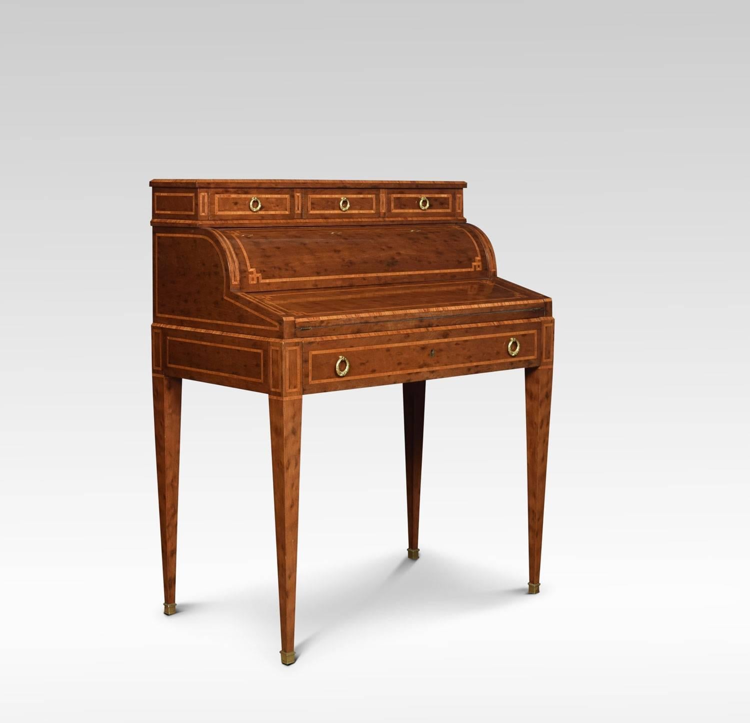 Late 19th century plum pudding mahogany cylinder top writing desk the raised top fitted with three short drawers with brass tolled handles. To the mechanical action cylinder front opening to reveal fitted interior and gilt tooled black leather inset