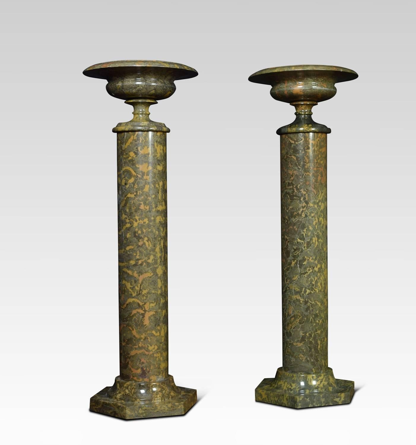 A pair of floor standing mottled green and ochre marble columns of good scale together with a pair of tazzas, having finely turned bowls and scocles.
This pair of columns and tazze would have been made to stand either side of a grand commode or
