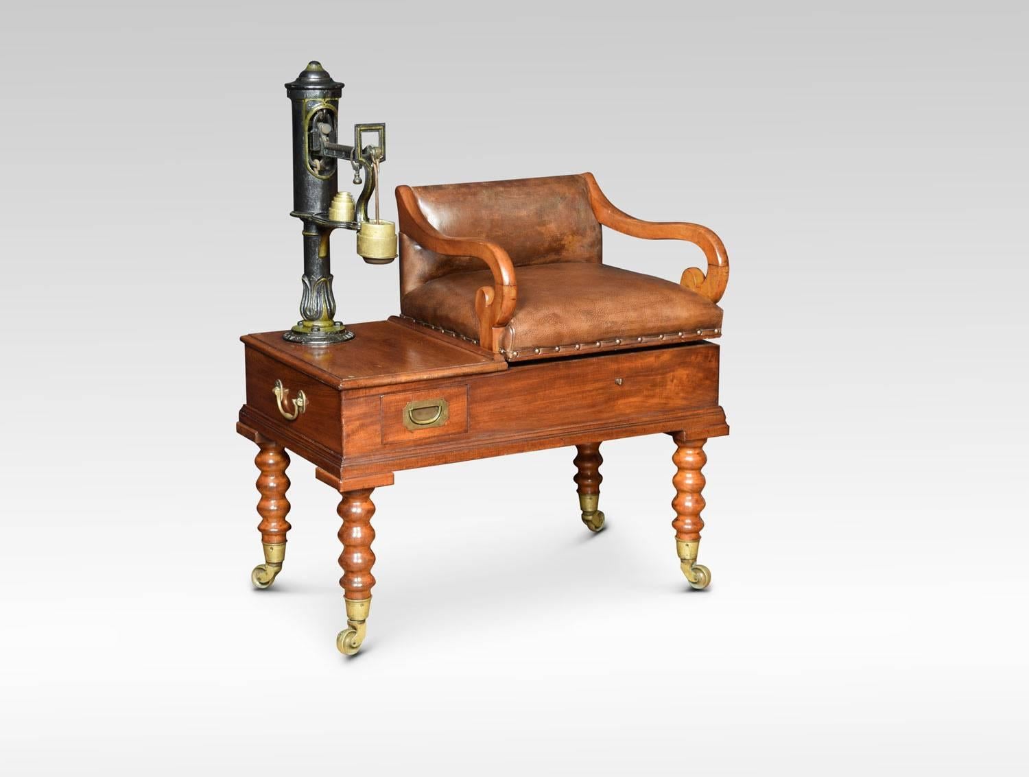 Set of Victorian jockey scales by W & T Avery, Birmingham .The brown leather upholstered seat, with decorated balance scale, having petal moulding to the base, over a short weight drawer enclosing various original engraved period weights, standing