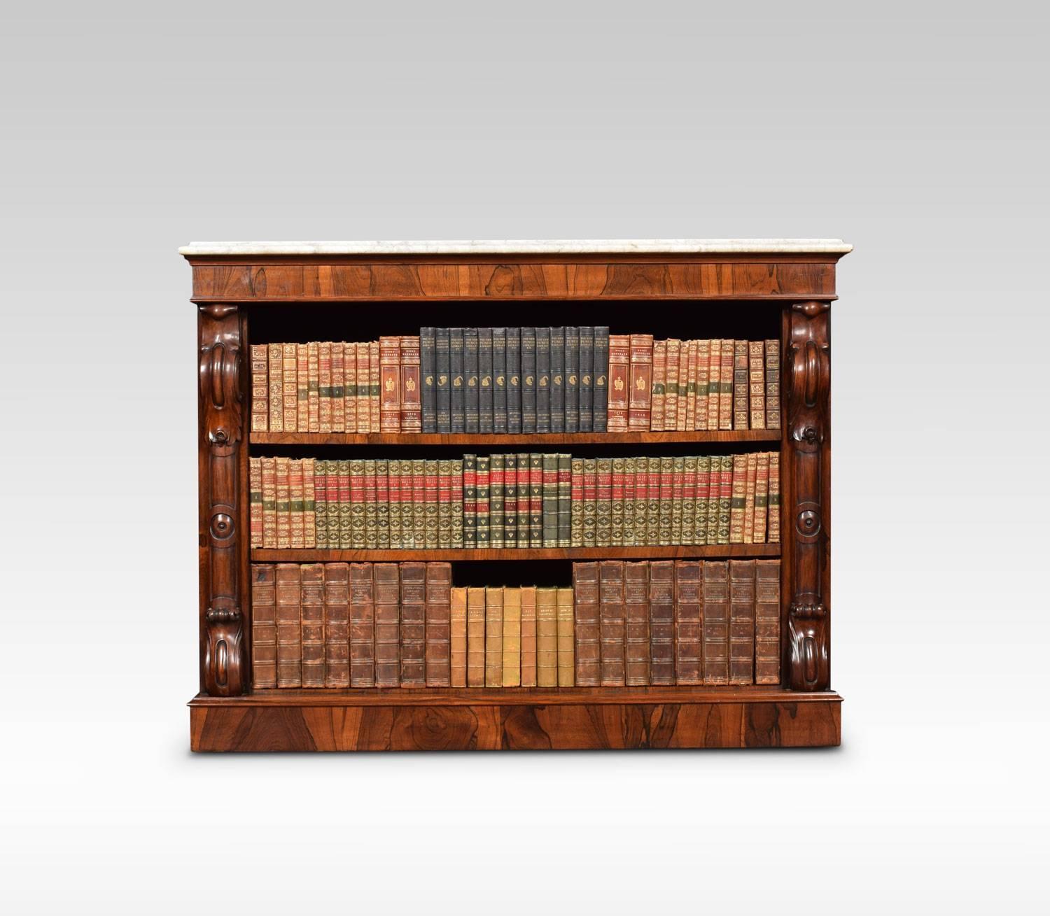 Regency rosewood open bookcase, the rectangular white veined marble-top above molded freeze with carved scrolling columns, enclosing two adjustable shelves, all raised up on plinth base.
Dimensions
Height 38.5 inches
Width 50 inches
Depth 17.5
