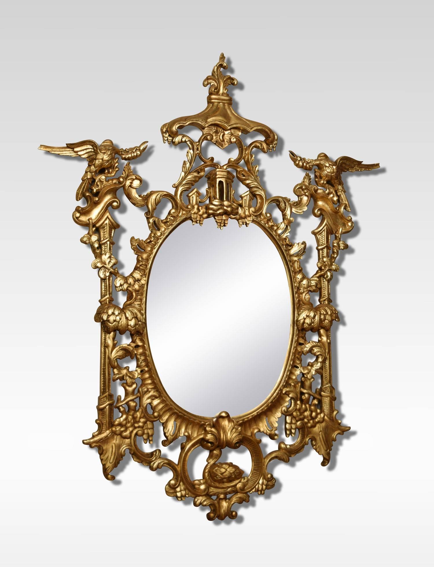 A Pair of Chinese Chippendale style giltwood wall mirrors, the oval plates surrounded by pagoda tops and flanked by griffins.
Dimensions
Height 61.5 inches
Width 47 inches
Depth 3 inches.