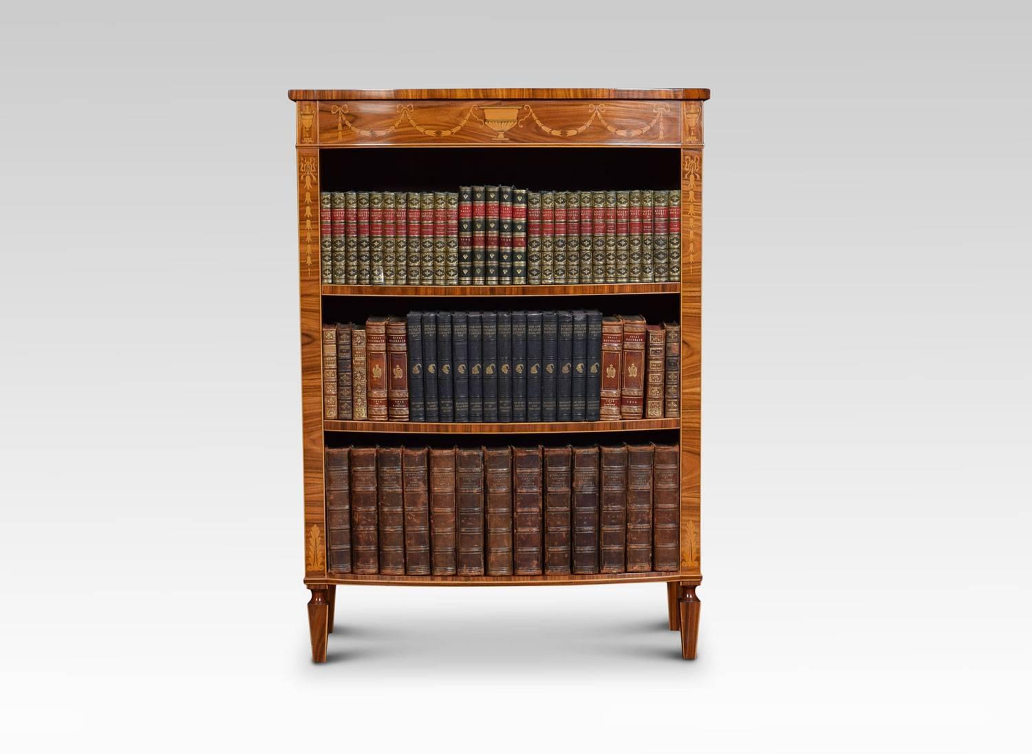 Sheraton Revival rosewood bookcase, the bow fronted kingwood crossbanded top above inlaid urn and ribbon tied swag decorated frieze. The bookcase fitted with two adjustable shelves. All raised on square sectioned tapering legs.
Dimensions:
Height