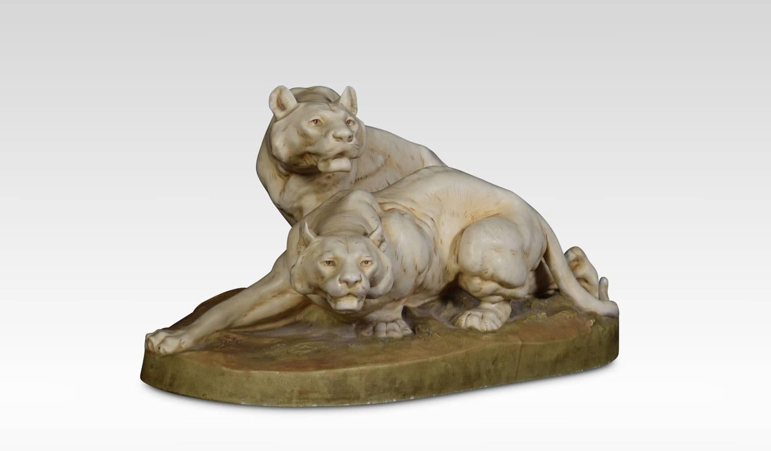 Royal Dux figure of two lionesses raised up on naturalistic base. Applied pink triangle makers mark to underside of base.
Dimensions
Height 9.5 inches
Width 18 inches
Depth 11 inches.