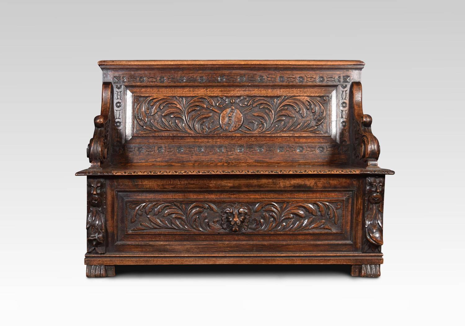 A oak hall settle the carved panelled back with foliated motif and scrolling arm rests. To the lift up seat with panelled base below having lion mask decoration raised up on paw feet.
Dimensions
Height 35.5 Inches Height to Seat 17 Inches
Width 49.5