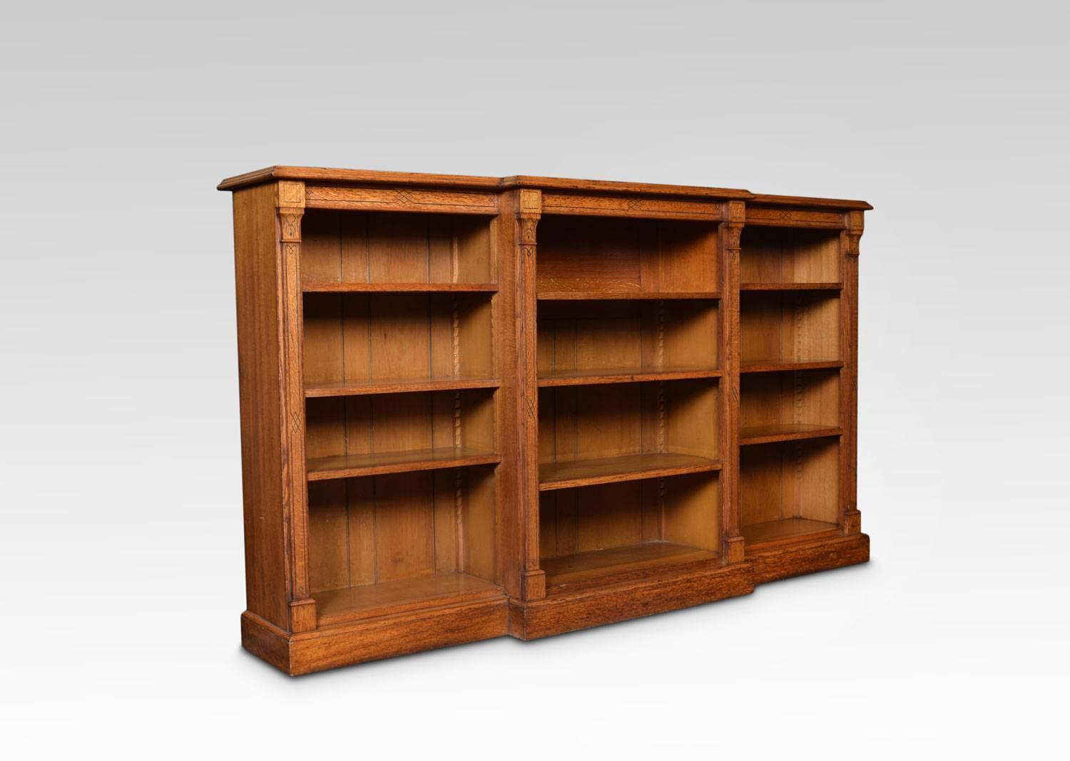 Reformed Gothic oak open breakfront bookcase, the large rectangular top above three bays of adjustable shelves divided by carved columns pilasters. All raised up on plinth base.
Dimensions
Height 48 Inches
Width 84 Inches
Depth 17 Inches