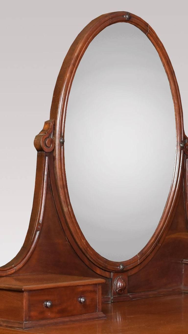 

Victorian mahogany dressing table by Edwards & Roberts, the oval swing mirror flanked by two short drawers above two further drawers all raised up on reeded legs terminating in brass caps and ceramic castors,

 

Height 62.5 Inches

Width