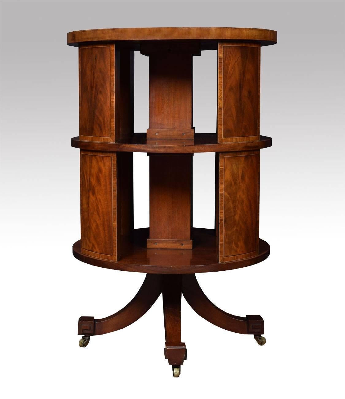 

Edwardian circular revolving bookcase the flame mahogany top with kingwood banded edge above an arrangement of shelves supported on  flame mahogany inlaid panels all raised up on cruciform base with original brass castors

Dimensions

Height