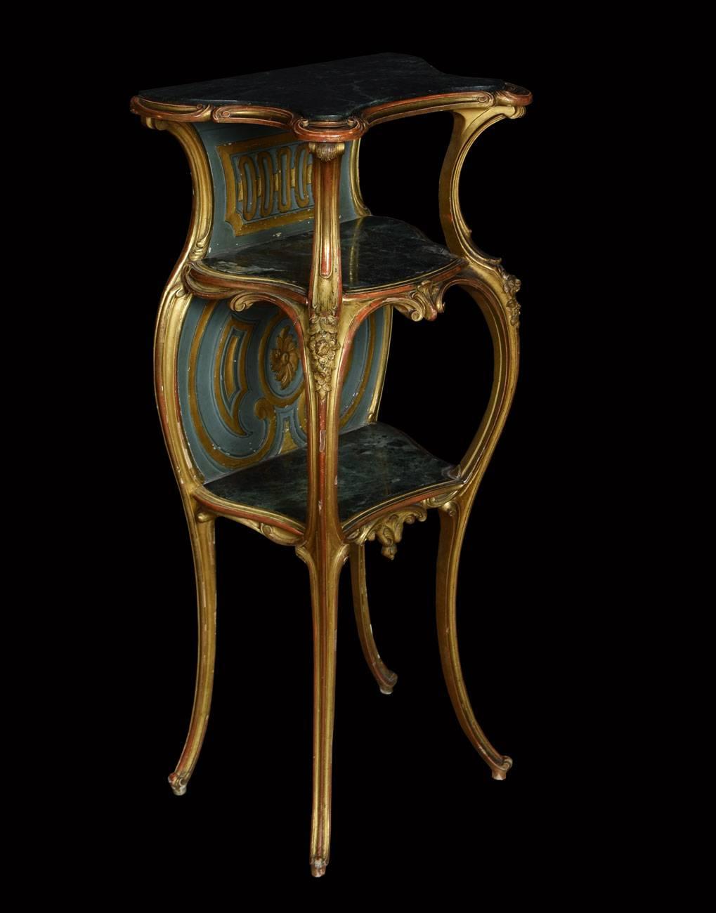 

Gilt wood rococo style whatnot having three tiers with green marble tops all raised up on slender cabriole supports

Dimensions
Height 42 Inches

Width 19 Inches

Depth 13 Inches
