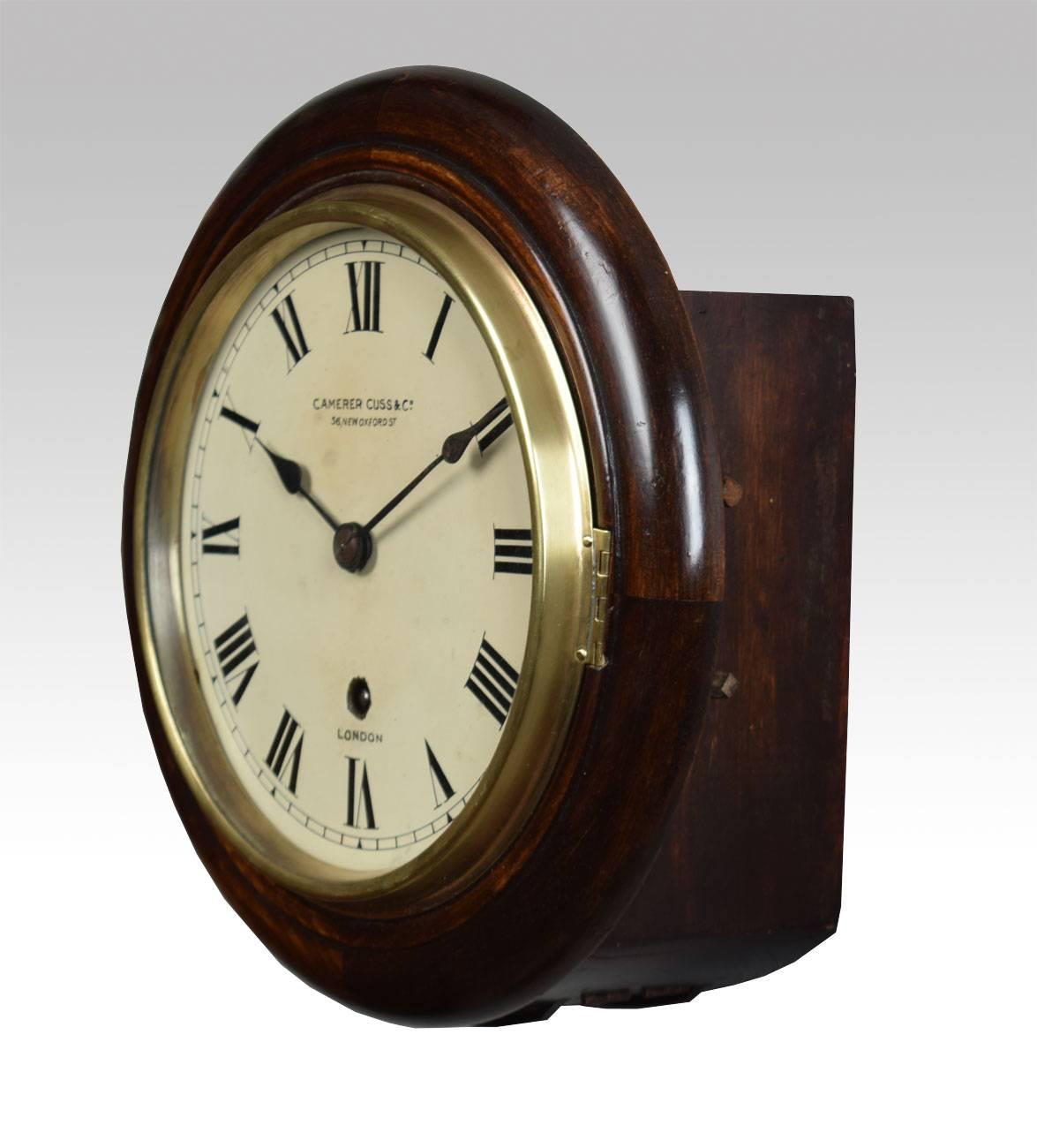 Mahogany Wall Clock, the circular case with glazed brass door to the painted dial with Roman numerals, single fusee movement signed Camerer Cuss & Co London

 Dimensions

Diameter 10.5 Inches

Depth 5 Inches 