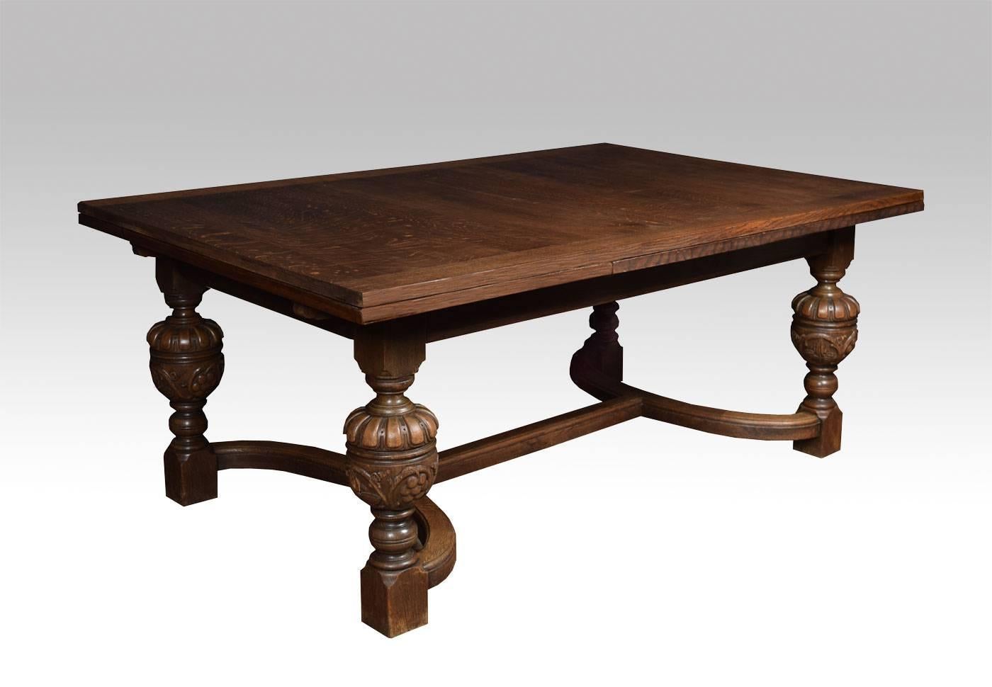 Large solid oak Jacobean revival table having two large extension leaves, and is capable of seating up to ten people. It stands on four carved bulbous legs, united by crinoline stretcher.

Dimensions:

Height 30 Inches.

Length 72 inches when