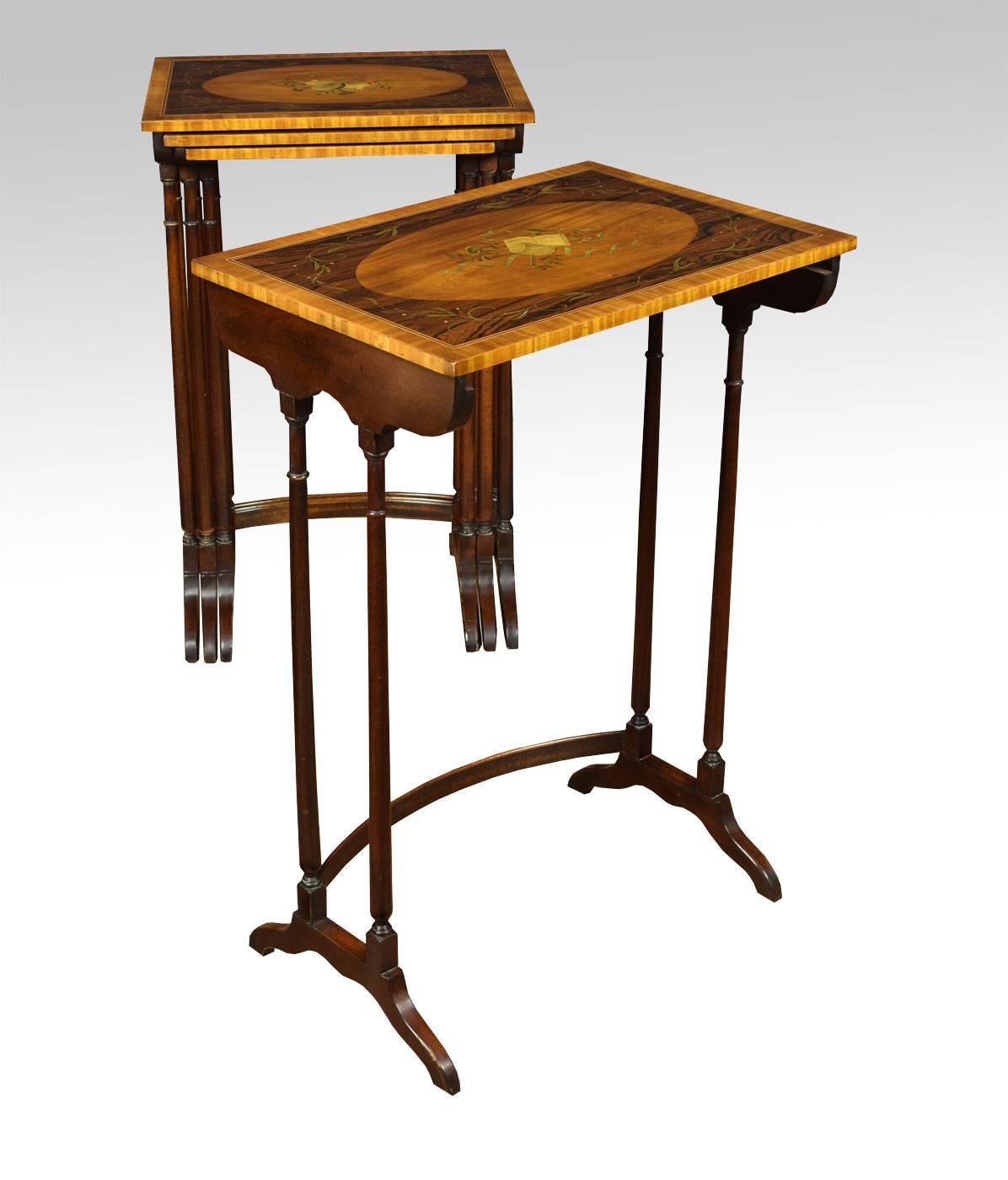 

Nest of four Sheraton revival mahogany, rosewood and satinwood tables, each of rectangular form. Painted with floral sprays, Garry and musical instruments all raised up on ring turned supports, with down swept sledge