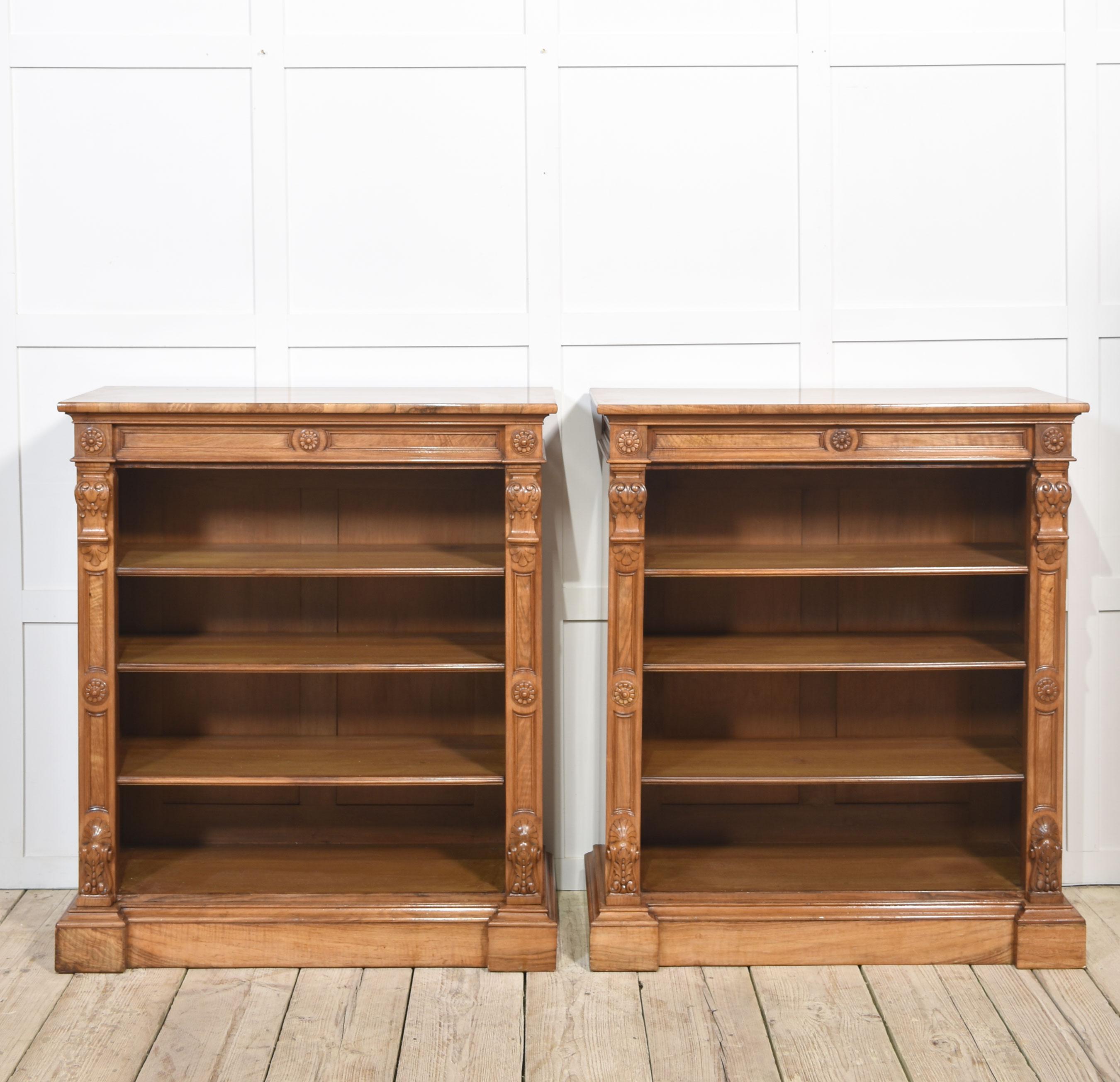 Pair of 19th-century walnut open bookcases, the rectangular well-figured tops to the carved freeze, above the adjustable shelved interior, flanked by carved columns, all raised on plinth base.
Dimensions
Height 44 Inches
Width 39 Inches
Depth 15.5
