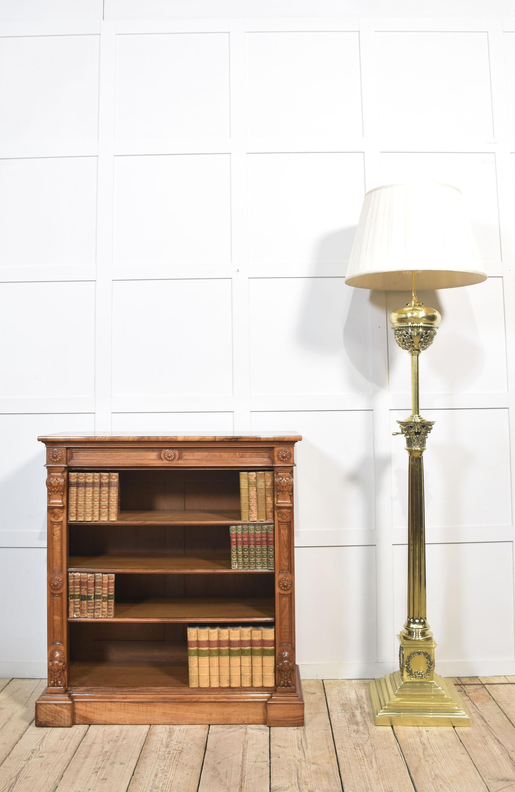 Very large, 19th-century brass standard lamp. Having a decorative oil reservoir, above the thick Corinthian column and an adjustable stem, raised up on a large stepped square base. The lamp has been rewired. Converted to