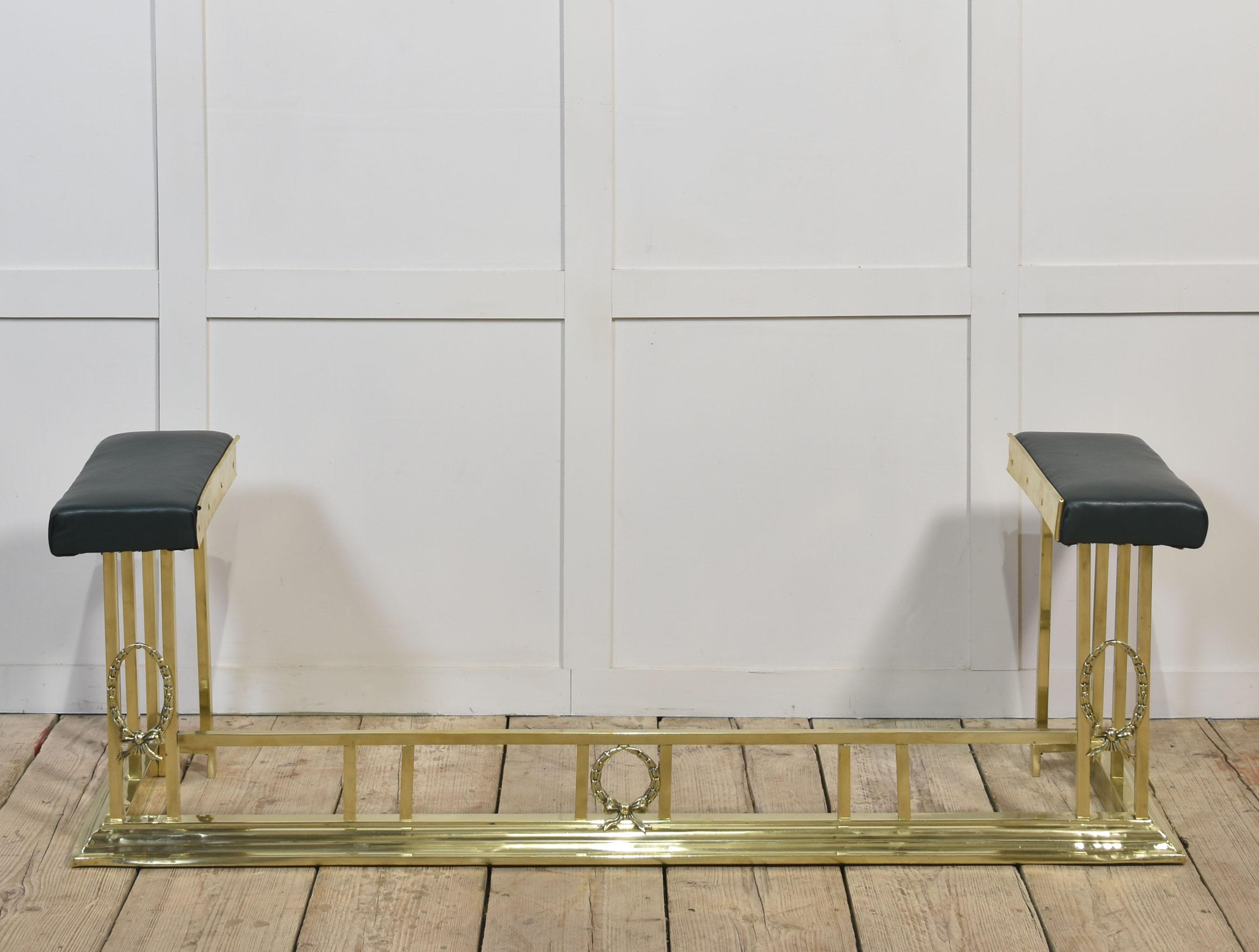 Brass club fender, the leather upholstered stools on square supports united by a plinth base.
Dimensions
Height 19 Inches
External measurements
Length 58.5 Inches
Depth 15.5 Inches
Internal measurements
Length 42.5 Inches
Depth 12 Inches